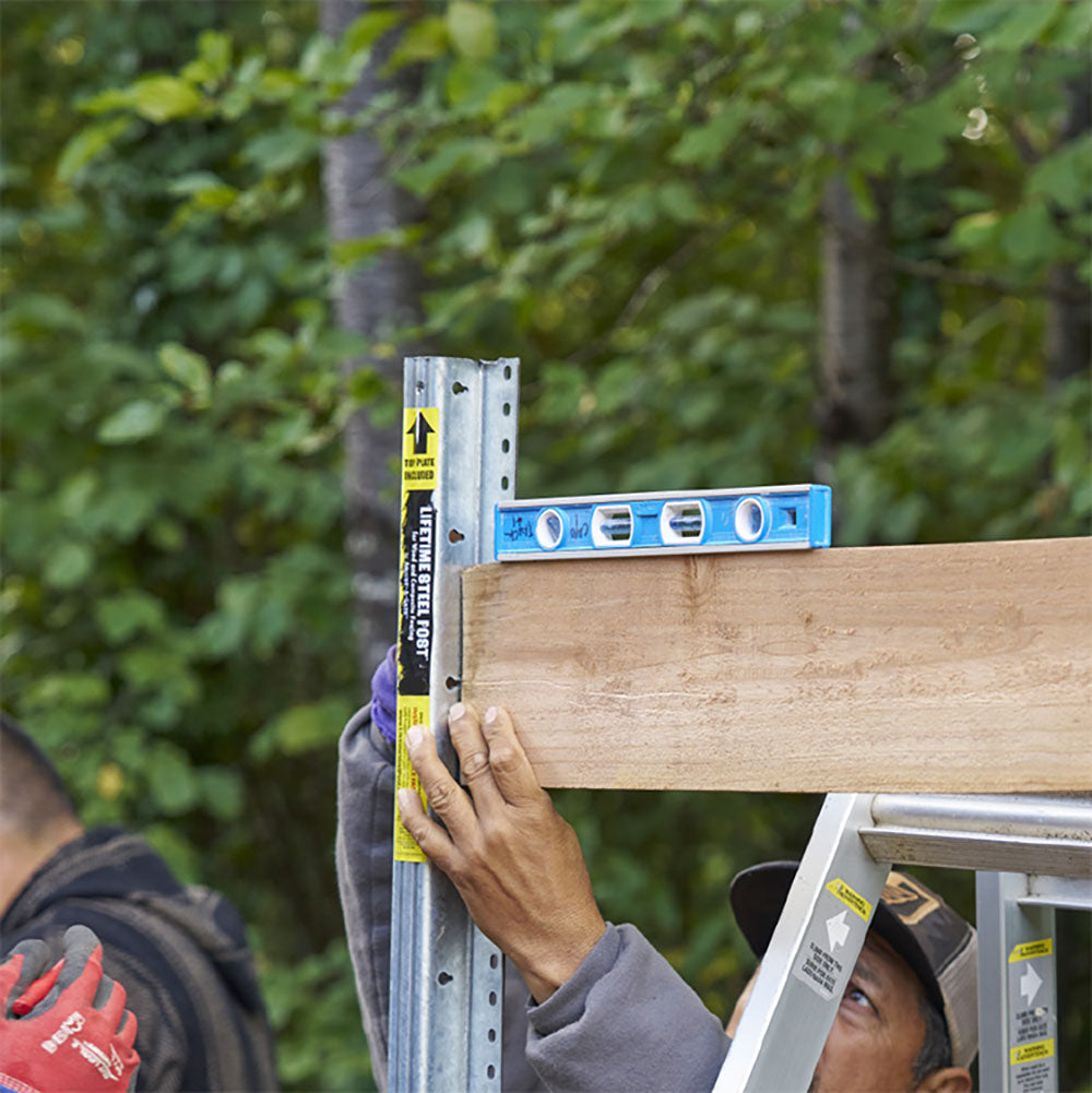 Leveling out Lifetime Steel Post® installation.