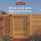 Wooden gate with Adjust-A-Gate logo and text on a blue sky background